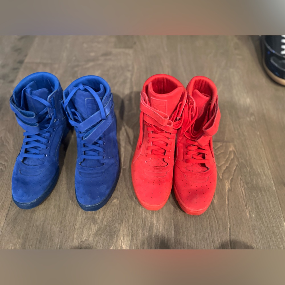 Selling two pairs of solid high top Puma shoes, great condition.